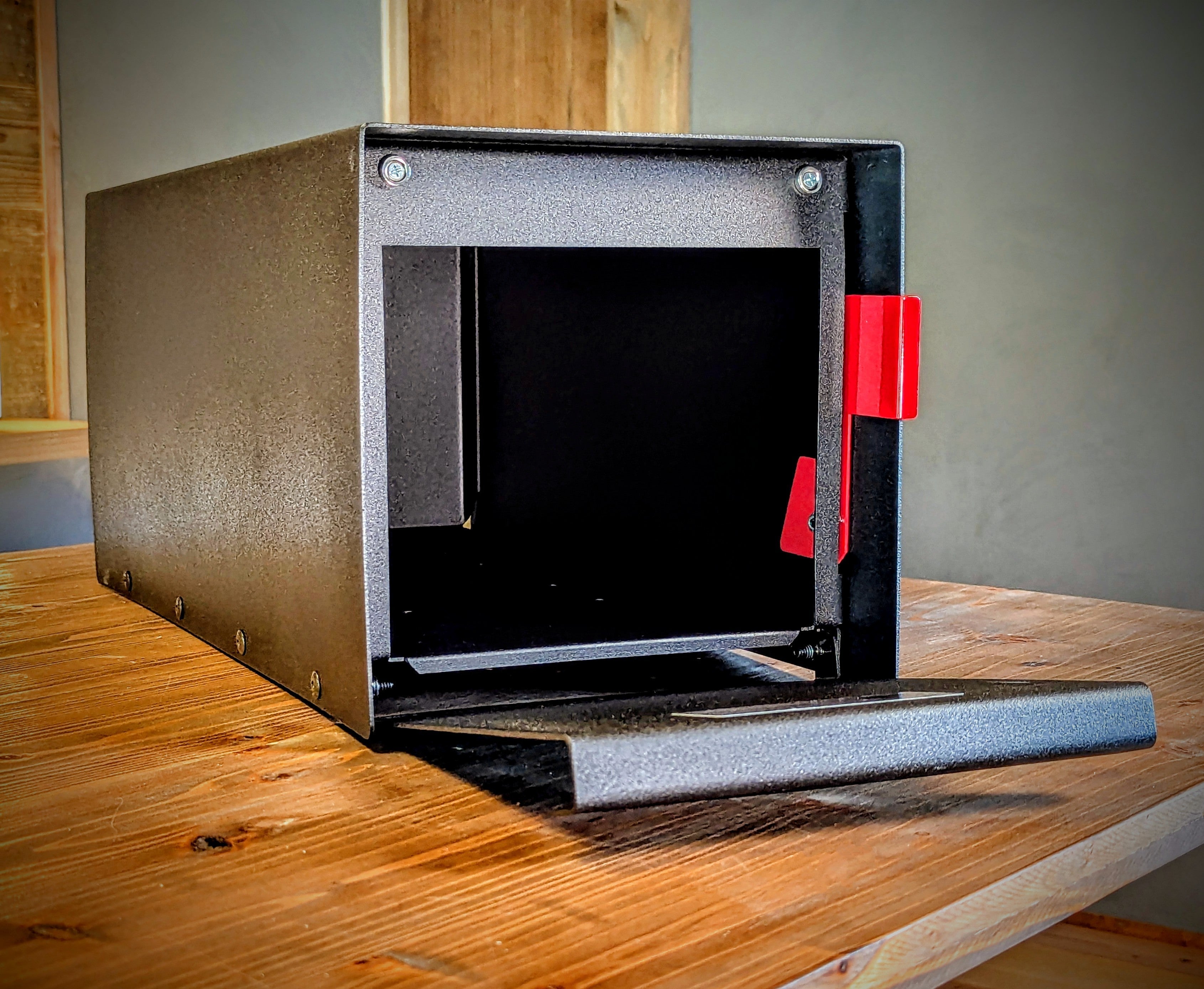 Open modern mailbox on desk 